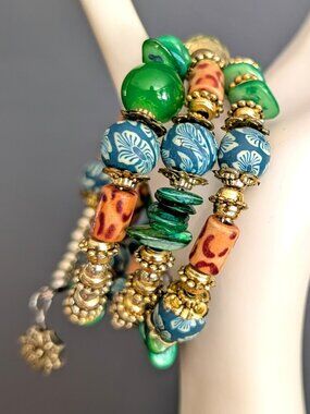 Memory wire silver, gold, green, beige and blue bracelet